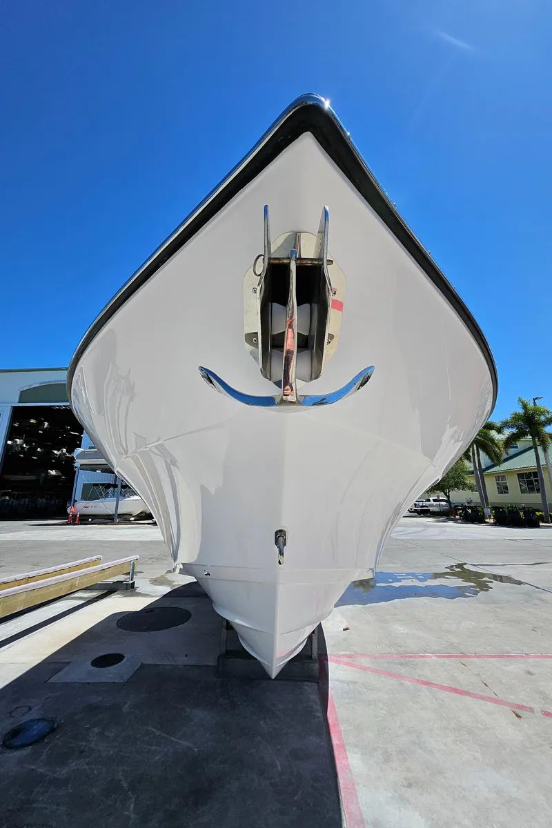 Slide: The Image of 2022 Century 2900 Center Console boat, front view, displayed outdoors under clear blue sky. - 45