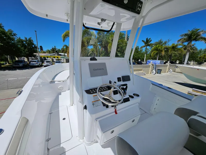 Slide: The Image of 2022 Century 2900 Center Console boat with modern helm and Garmin navigation system. - 9