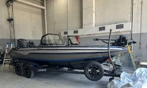 Slide: The Image of 2025 Skeeter WXR 2060F boat in a garage, on a trailer. - 1