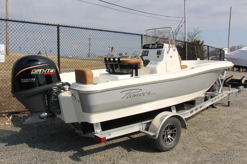 Slide: The Image of 2025 Pioneer 180 Sportfish boat on trailer with Yamaha outboard motor. - 1