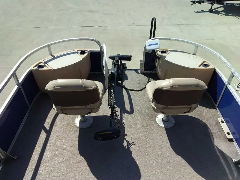 Slide: The Image of 2017 Sun Tracker Fishing Barge 22 XP3 interior with two swivel seats and fishing equipment. - 6