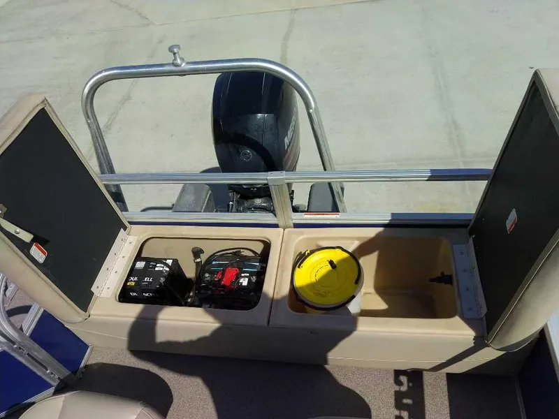 Slide: The Image of 2017 Sun Tracker Fishing Barge 22 XP3 storage compartments with battery and equipment. - 8