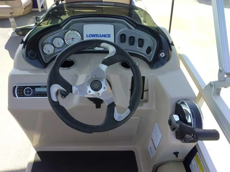 Slide: The Image of 2017 Sun Tracker Fishing Barge 22 XP3 dashboard with steering wheel and controls. - 9