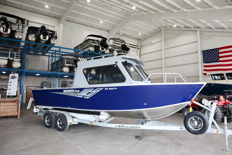 Slide: The Image of 2025 Hewescraft 240 Ocean Pro ET HT boat in showroom on trailer. - 0
