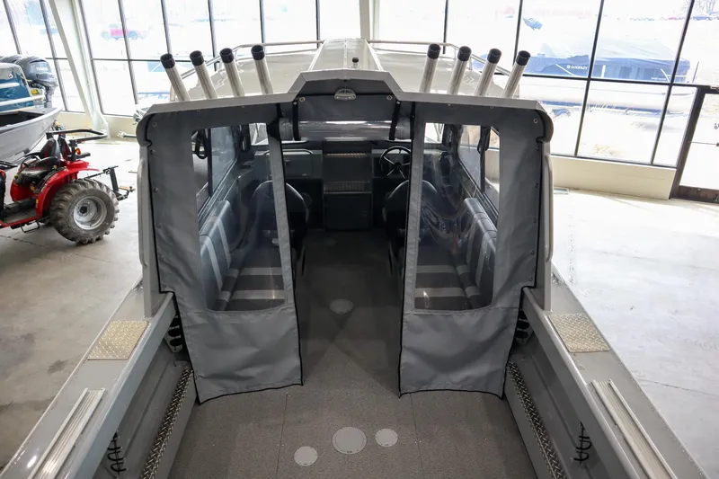 Slide: The Image of 2025 Hewescraft 240 Ocean Pro ET HT boat interior with seating and rod holders. - 11