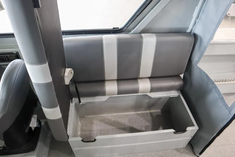 Slide: The Image of 2025 Hewescraft 240 Ocean Pro ET HT interior seat with storage compartment open. - 15