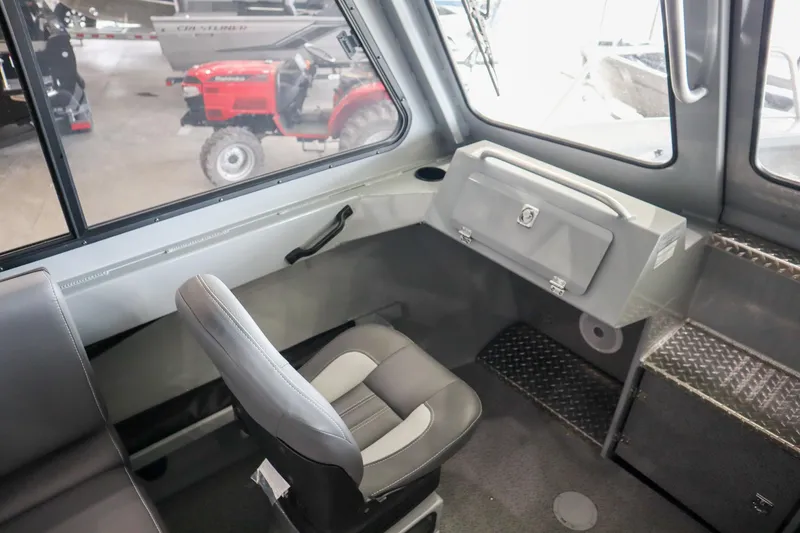 Slide: The Image of 2025 Hewescraft 240 Ocean Pro ET HT interior with seating and control panel. - 16