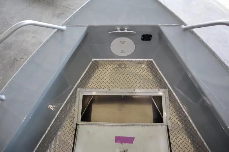 Slide: The Image of 2025 Hewescraft 240 Ocean Pro ET HT boat interior with diamond plate flooring. - 18