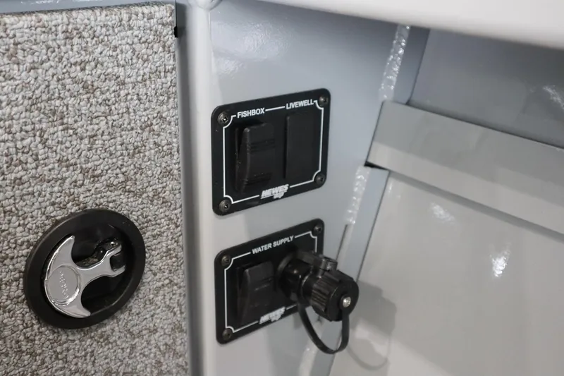 Slide: The Image of 2025 Hewescraft 240 Ocean Pro ET HT boat interior switches and water supply. - 22