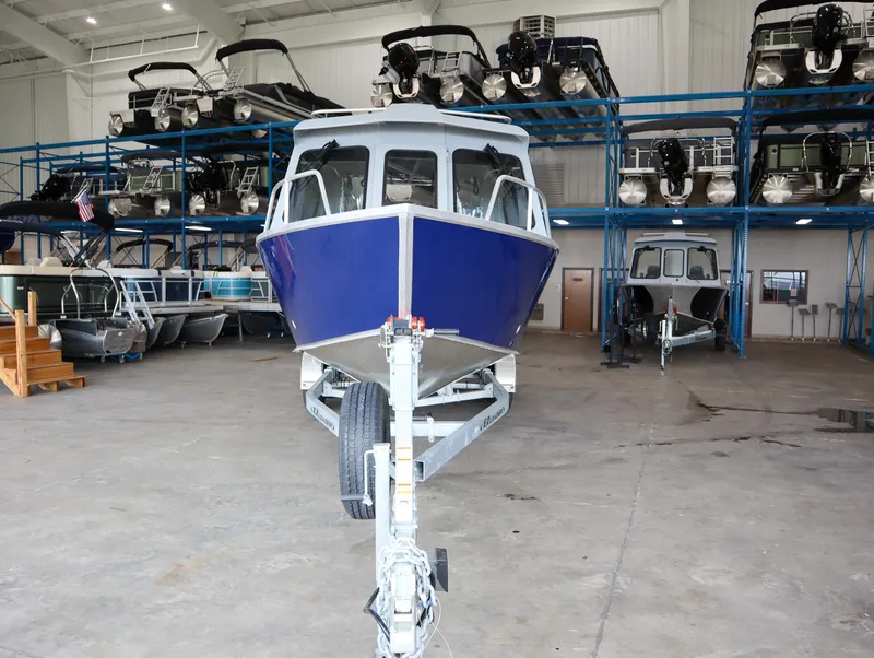 Slide: The Image of 2025 Hewescraft 240 Ocean Pro ET HT boat in indoor storage facility. - 4