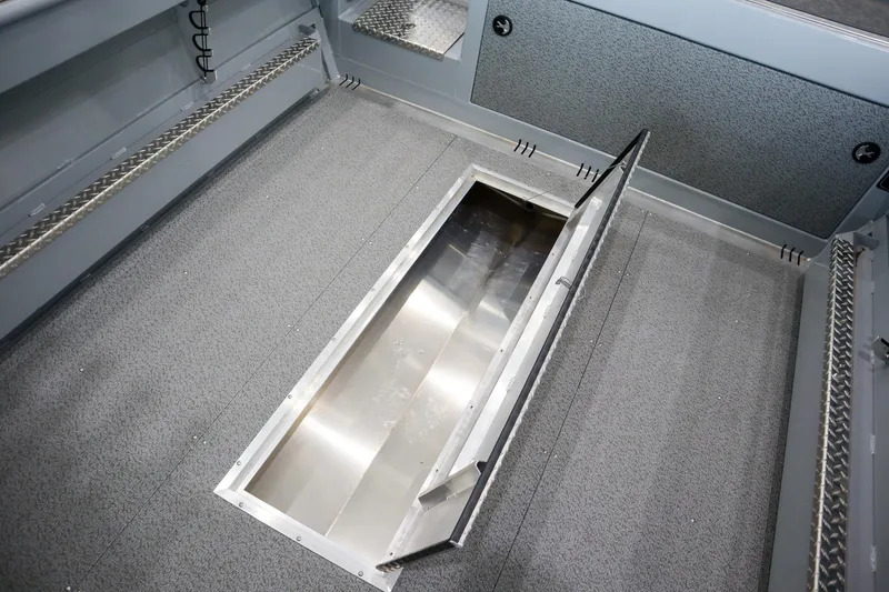 Slide: The Image of 2025 Hewescraft 240 Ocean Pro ET HT boat with open storage compartment. - 7