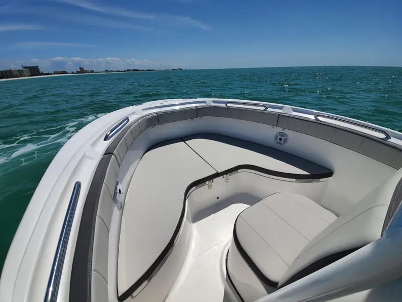 Slide: The Image of 2022 Aquasport 2300 Center Console boat on open water, clear sky. - 9