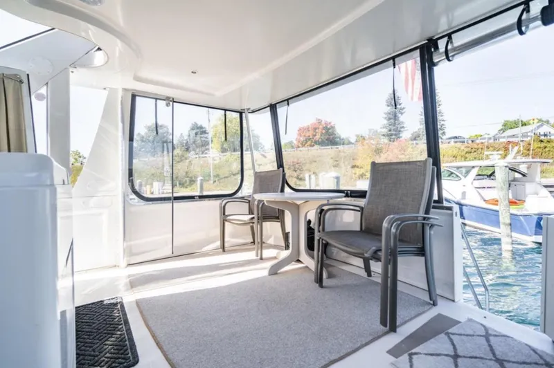 Slide: The Image of Spacious interior of 2000 Carver 406 Aft Cabin Motor Yacht with seating and table. - 15