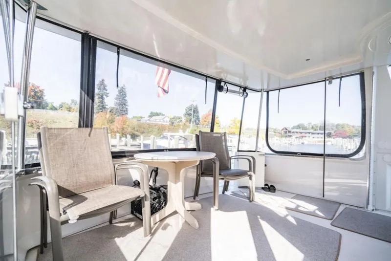 Slide: The Image of Interior of 2000 Carver 406 Aft Cabin Motor Yacht with seating and table. - 16