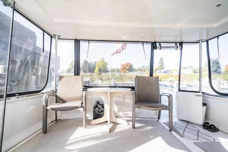 Slide: The Image of Interior of 2000 Carver 406 Aft Cabin Motor Yacht with chairs and table. - 17