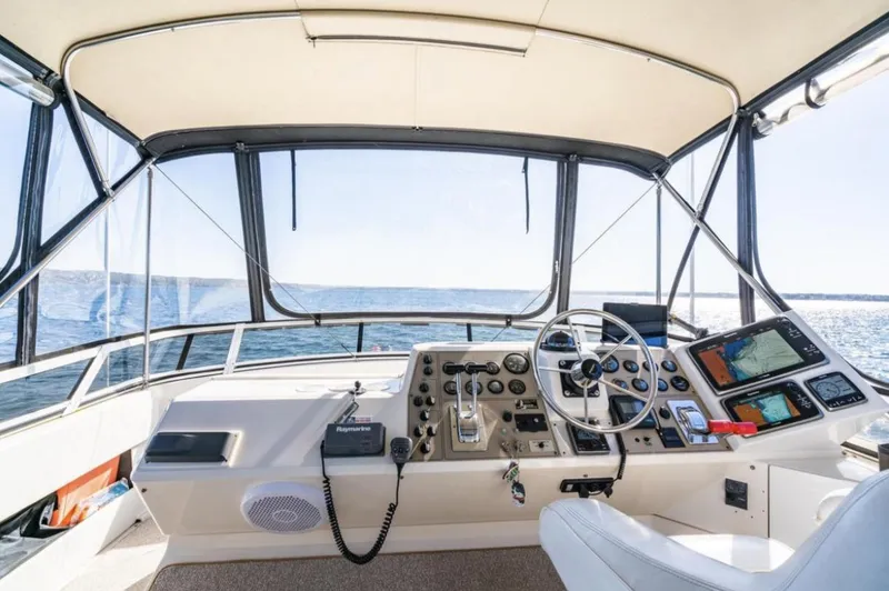 Slide: The Image of Helm of 2000 Carver 406 Aft Cabin Motor Yacht with navigation equipment. - 21