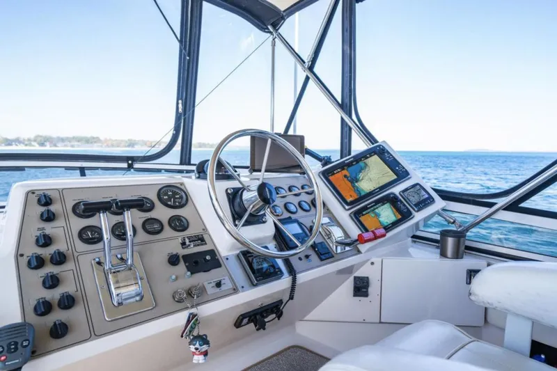 Slide: The Image of Helm of 2000 Carver 406 Aft Cabin Motor Yacht with navigation equipment and ocean view. - 23