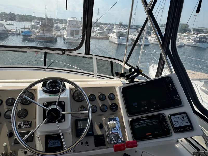 Slide: The Image of Helm of 2000 Carver 406 Aft Cabin Motor Yacht in marina setting. - 28