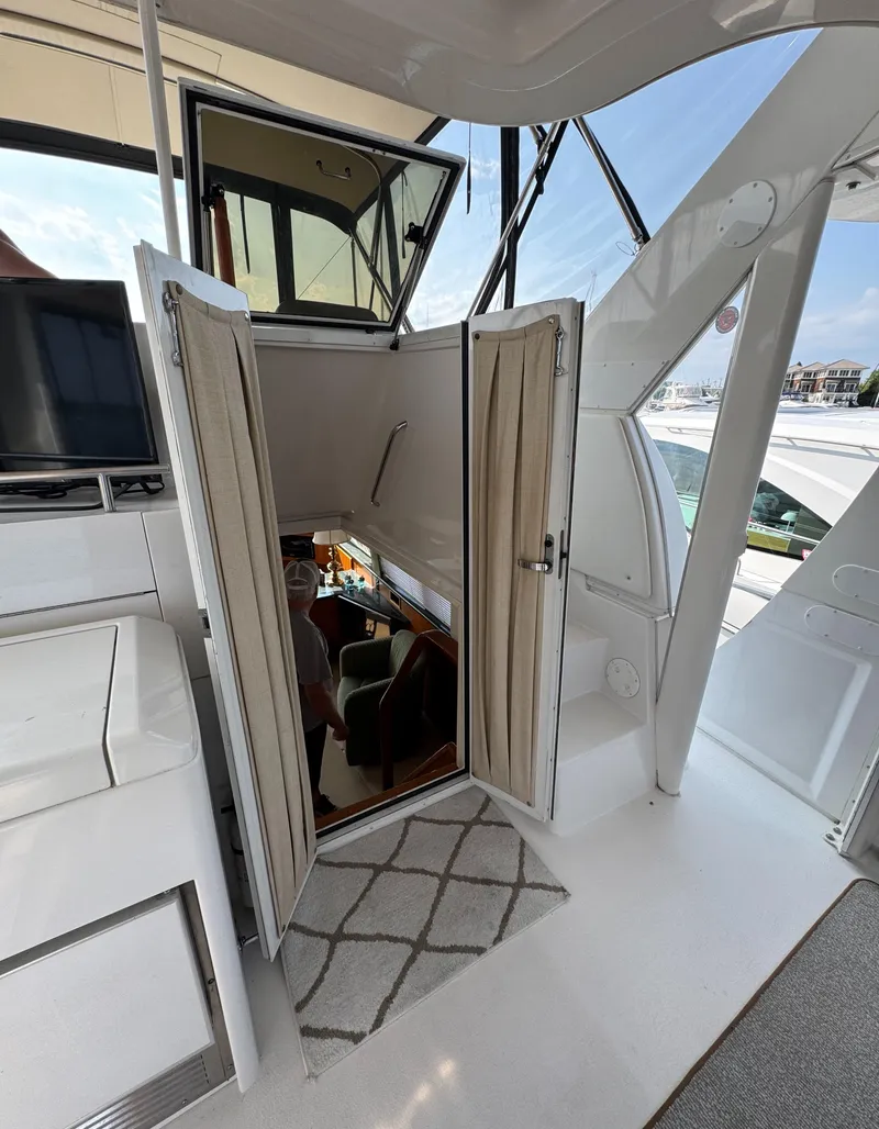 Slide: The Image of 2000 Carver 406 Aft Cabin Motor Yacht interior with open door and modern design. - 29