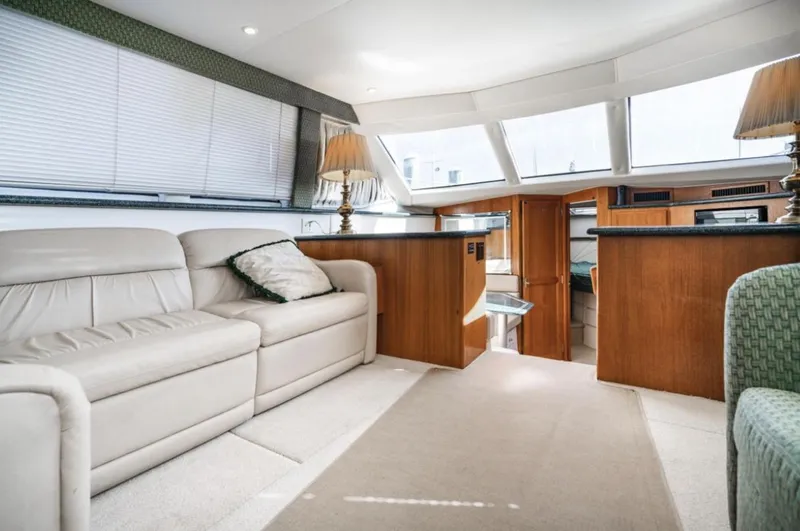 Slide: The Image of Luxurious interior of 2000 Carver 406 Aft Cabin Motor Yacht with elegant furnishings. - 30