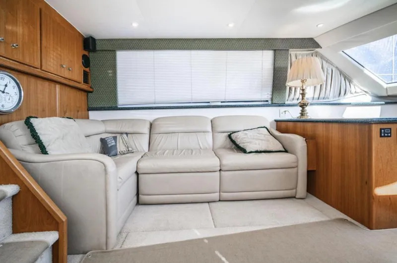 Slide: The Image of Interior of 2000 Carver 406 Aft Cabin Motor Yacht with beige leather sofa. - 33