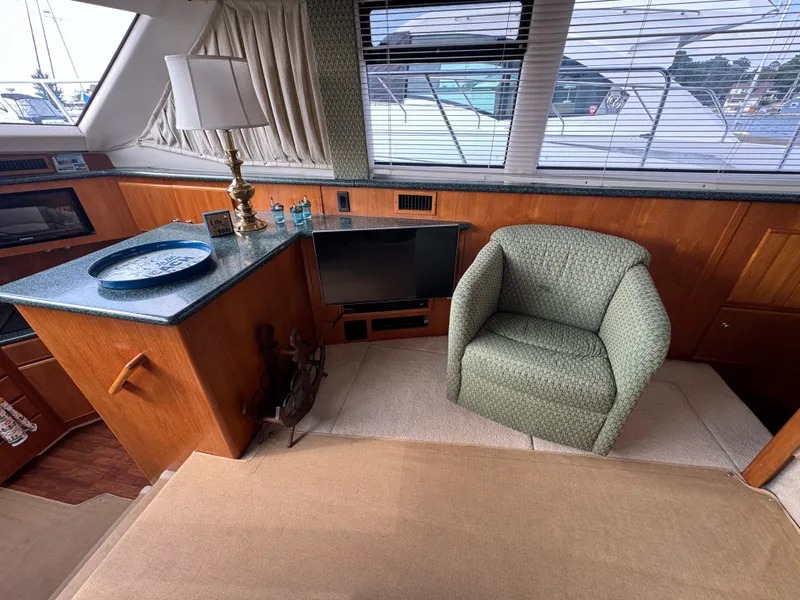 Slide: The Image of Interior of 2000 Carver 406 Aft Cabin Motor Yacht with chair and counter. - 36