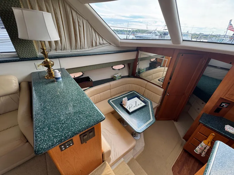Slide: The Image of Interior of 2000 Carver 406 Aft Cabin Motor Yacht with elegant seating and decor. - 40