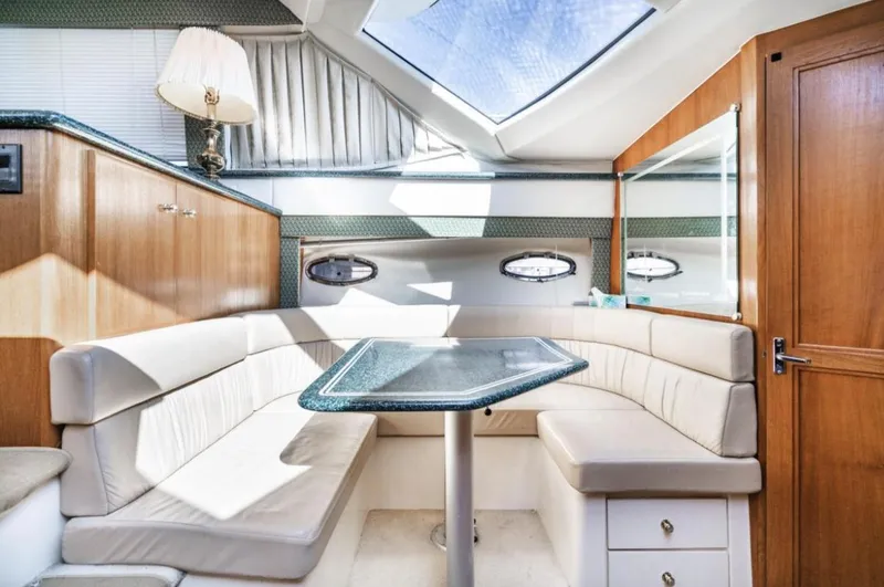 Slide: The Image of Interior of 2000 Carver 406 Aft Cabin Motor Yacht with elegant seating and skylight. - 41