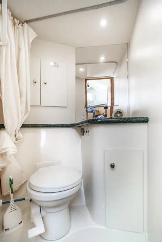 Slide: The Image of Bathroom interior of 2000 Carver 406 Aft Cabin Motor Yacht, featuring modern amenities. - 47