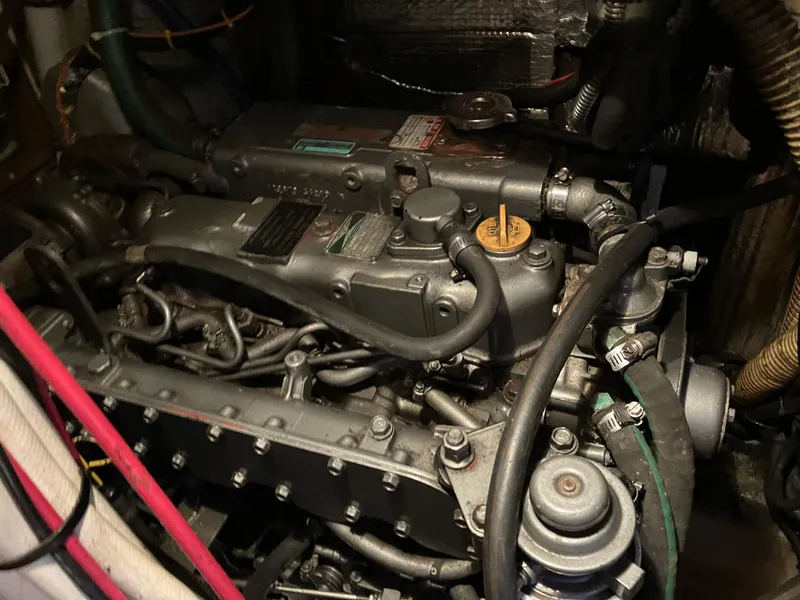 Slide: The Image of Engine of a 2001 Hunter Passage 450 sailboat, showcasing intricate mechanical components. - 19