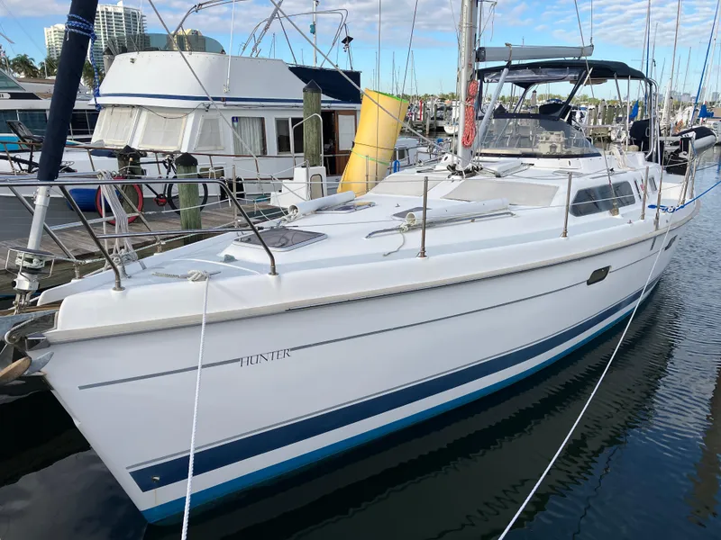 Slide: The Image of 2001 Hunter Passage 450 sailboat docked at marina, side view. - 2