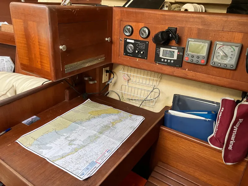 Slide: The Image of Navigation station on 2001 Hunter Passage 450 sailboat with map and instruments. - 23