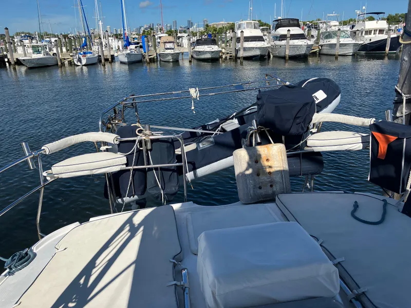 Slide: The Image of 2001 Hunter Passage 450 sailboat docked in a marina with other boats. - 38