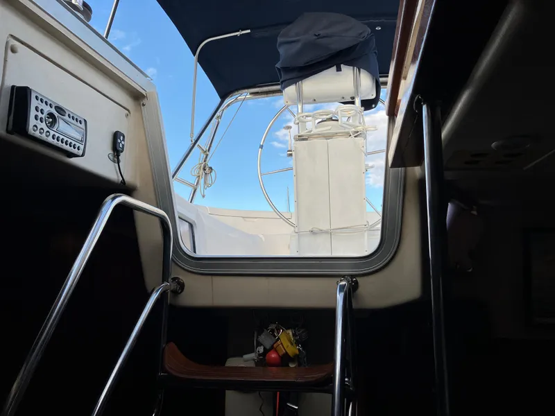 Slide: The Image of Interior view of a 2001 Hunter Passage 450 sailboat, showing cockpit and navigation equipment. - 8