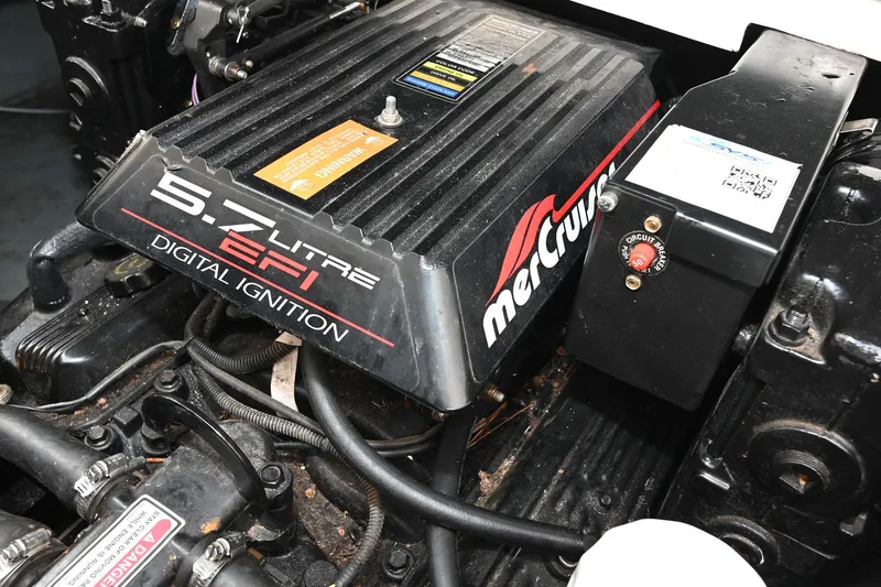 Slide: The Image of 5.7L EFI engine of 1998 Sea Ray 240 Sundancer with digital ignition system. - 27