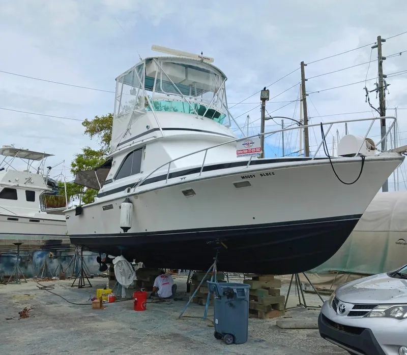 Slide: The Image of 1979 Bertram 35 Sport Fisherman boat on dry dock for maintenance. - 7
