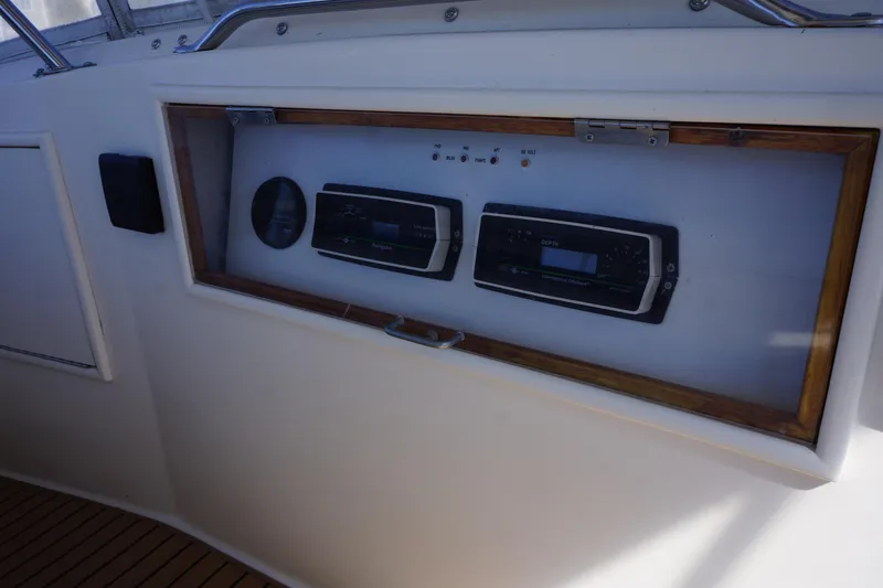 Slide: The Image of Control panel of a 1988 Ocean Yachts Super Sport boat, featuring navigation instruments. - 29