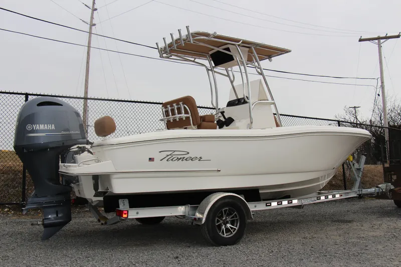 Slide: The Image of 2025 Pioneer 202 Sportfish boat on trailer with Yamaha outboard motor. - 2