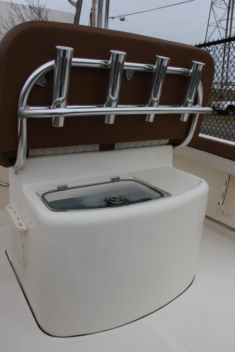Slide: The Image of 2025 Pioneer 202 Sportfish boat with rod holders and storage compartment. - 6