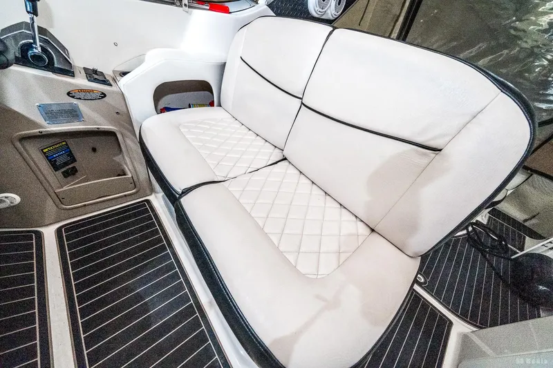 Slide: The Image of 2001 Bayliner 3055 Ciera interior with white cushioned seating and sleek design. - 18