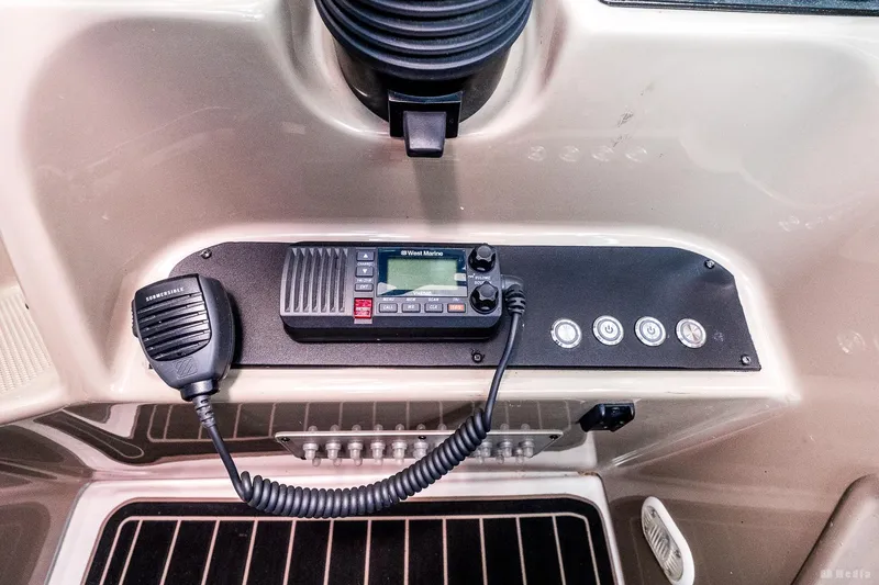 Slide: The Image of Control panel of a 2001 Bayliner 3055 Ciera boat with radio and microphone. - 21