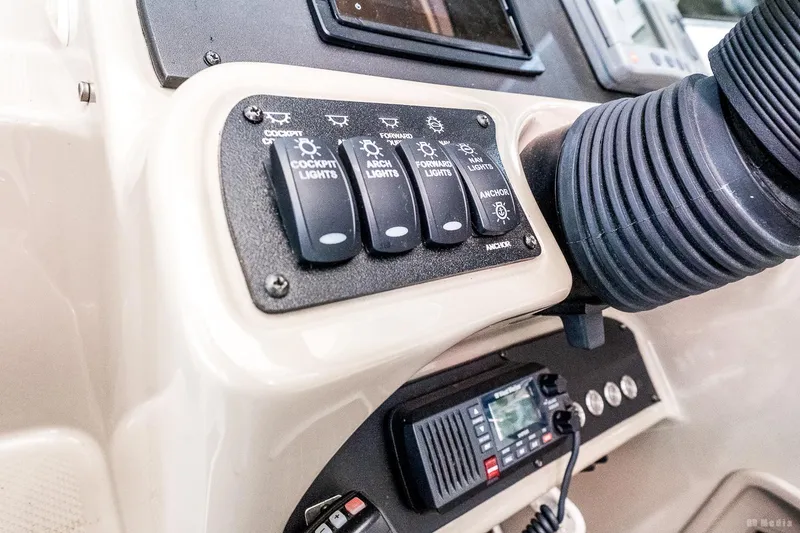 Slide: The Image of Control panel of a 2001 Bayliner 3055 Ciera boat with switches and radio. - 22