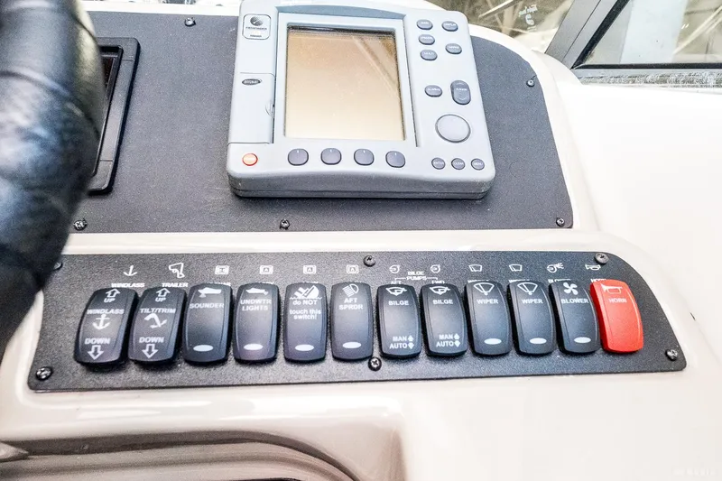 Slide: The Image of Control panel of a 2001 Bayliner 3055 Ciera boat with navigation equipment. - 23