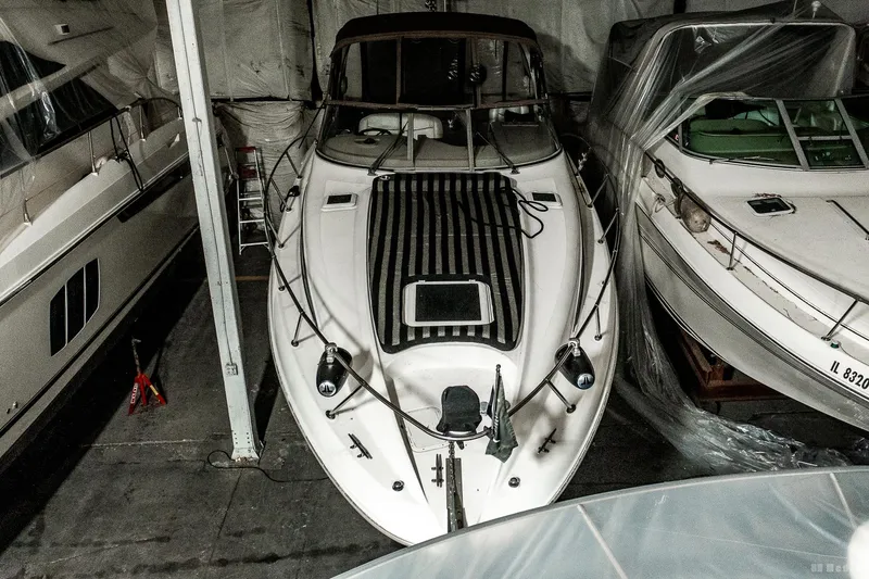 Slide: The Image of 2001 Bayliner 3055 Ciera boat in storage, covered and secured indoors. - 3