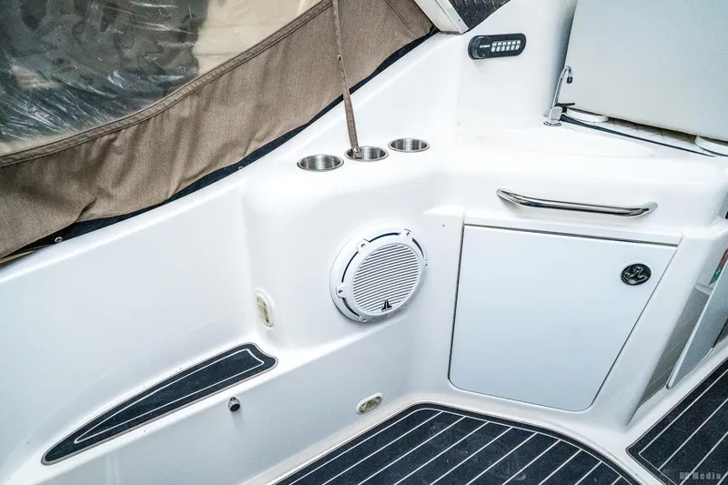Slide: The Image of 2001 Bayliner 3055 Ciera boat interior with speaker and storage compartment. - 31
