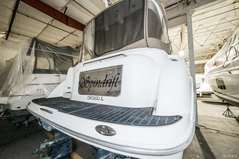 Slide: The Image of 2001 Bayliner 3055 Ciera boat in storage, rear view with "Spindrift" nameplate. - 35