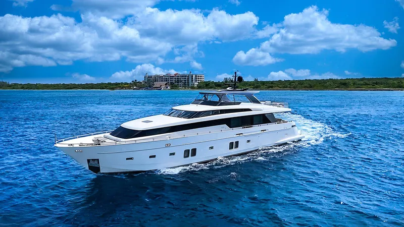 Slide: The Image of Luxurious 2014 Sanlorenzo SL104 yacht cruising on vibrant blue ocean waters. - 0