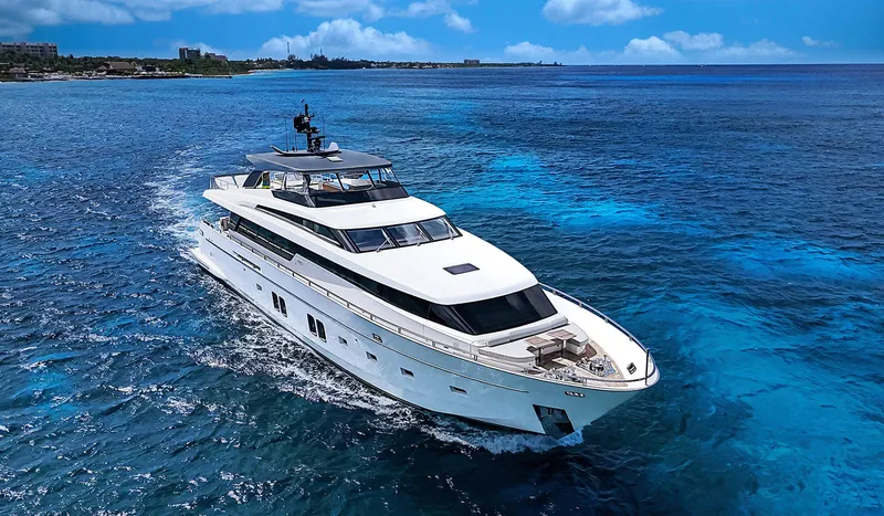 Slide: The Image of Luxurious 2014 Sanlorenzo SL104 yacht cruising in clear blue ocean waters. - 12