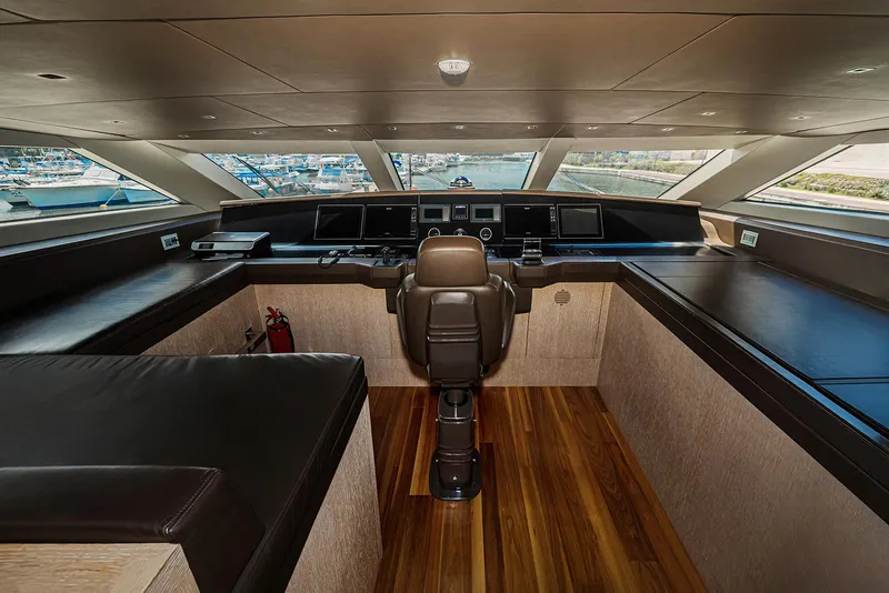 Slide: The Image of Luxurious helm of 2014 Sanlorenzo SL104 yacht with panoramic windows and modern controls. - 17