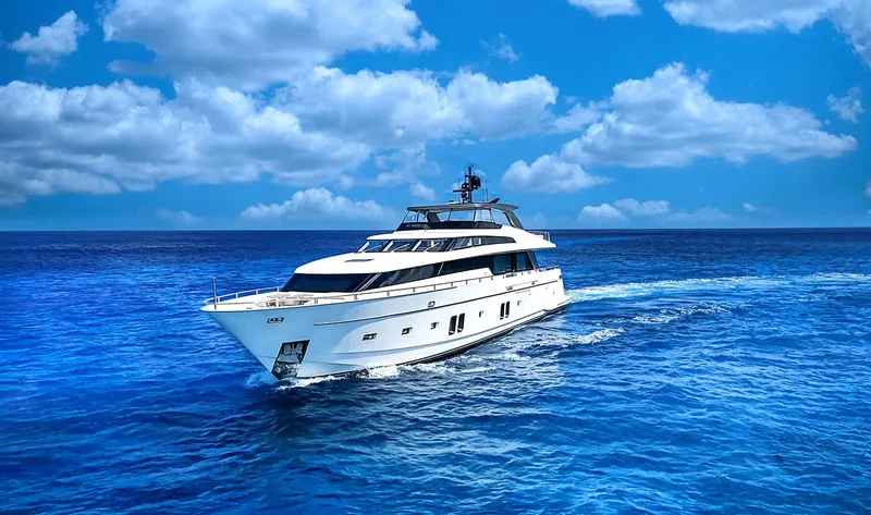 Slide: The Image of Luxurious 2014 Sanlorenzo SL104 yacht cruising on vibrant blue ocean under clear skies. - 2